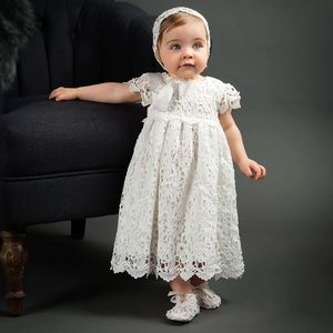 Baptism / Christening dress made out of eyelet fabric. Comes with head piece.